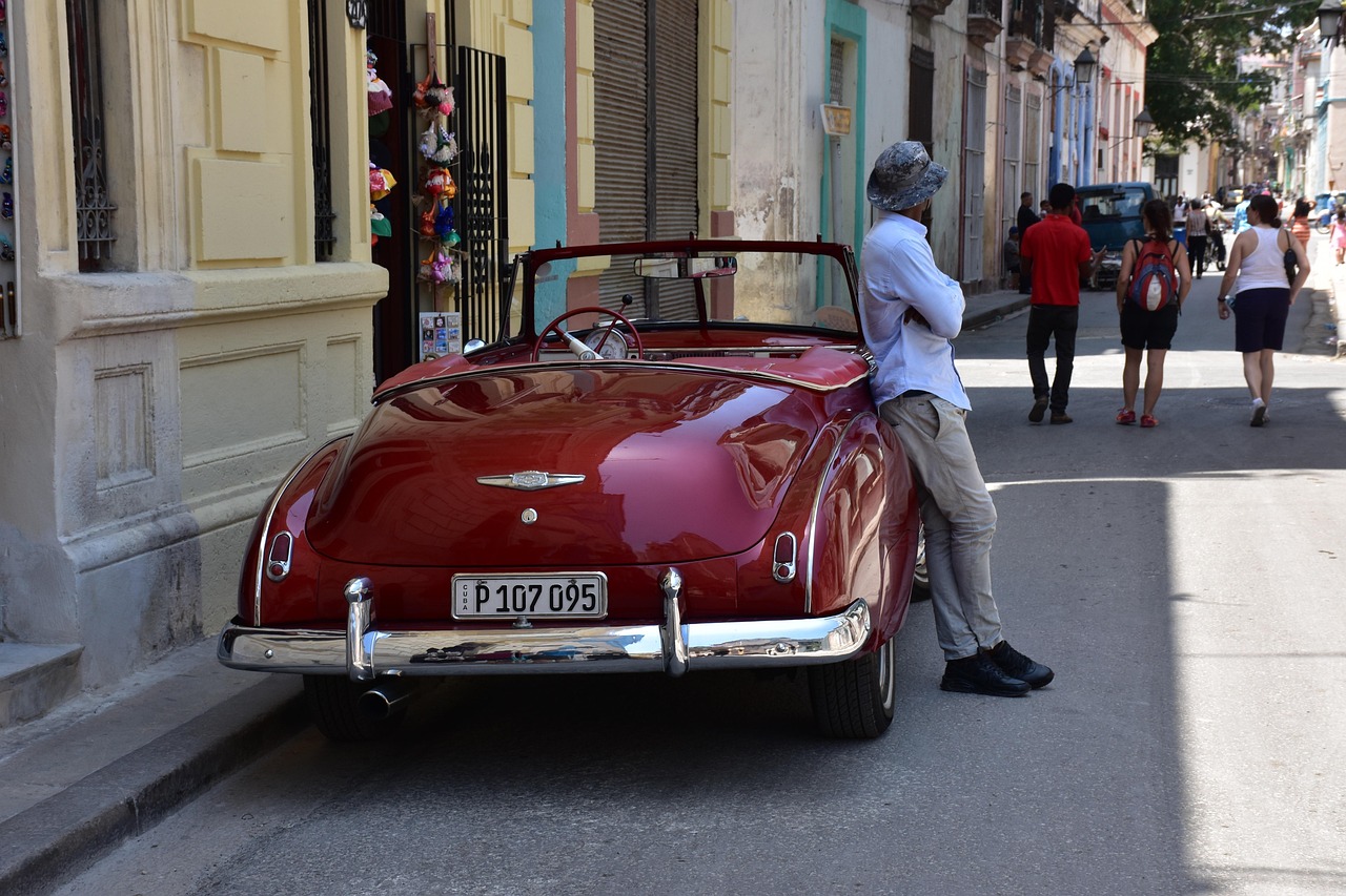 A person standing beside a car